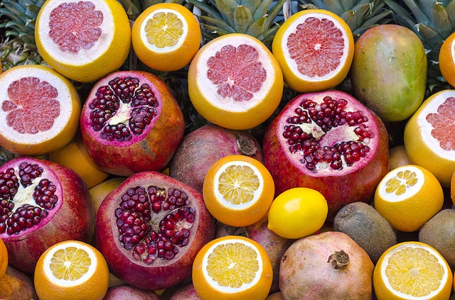 Cross sections of pomegranites, grapefruits, oranges, and lemons.