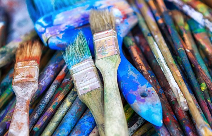 A collection of used paintbrushes