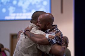 Two men hugging at church