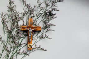 A crucifix on a bunch of lilacs