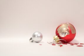Two Christmas ornaments - the larger one is broken