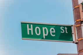 A street sign reading "Hope St"