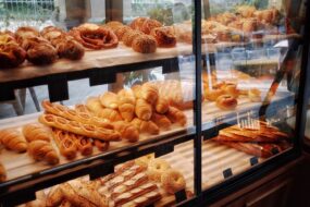 Bakery shelves laden with all different kinds of bread